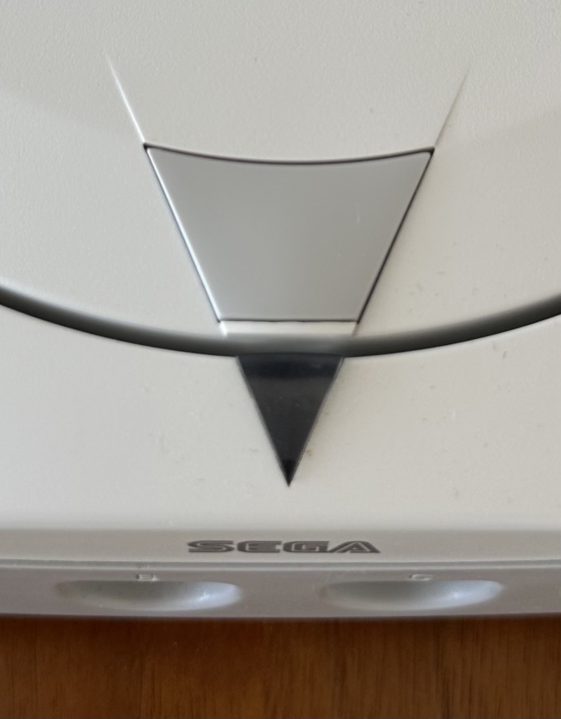 The translucent triangle badge on an NTSC-J Dreamcast lid