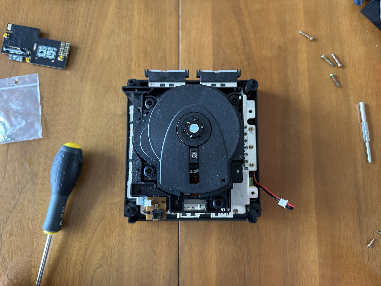 The complete optical drive mechanism, removed