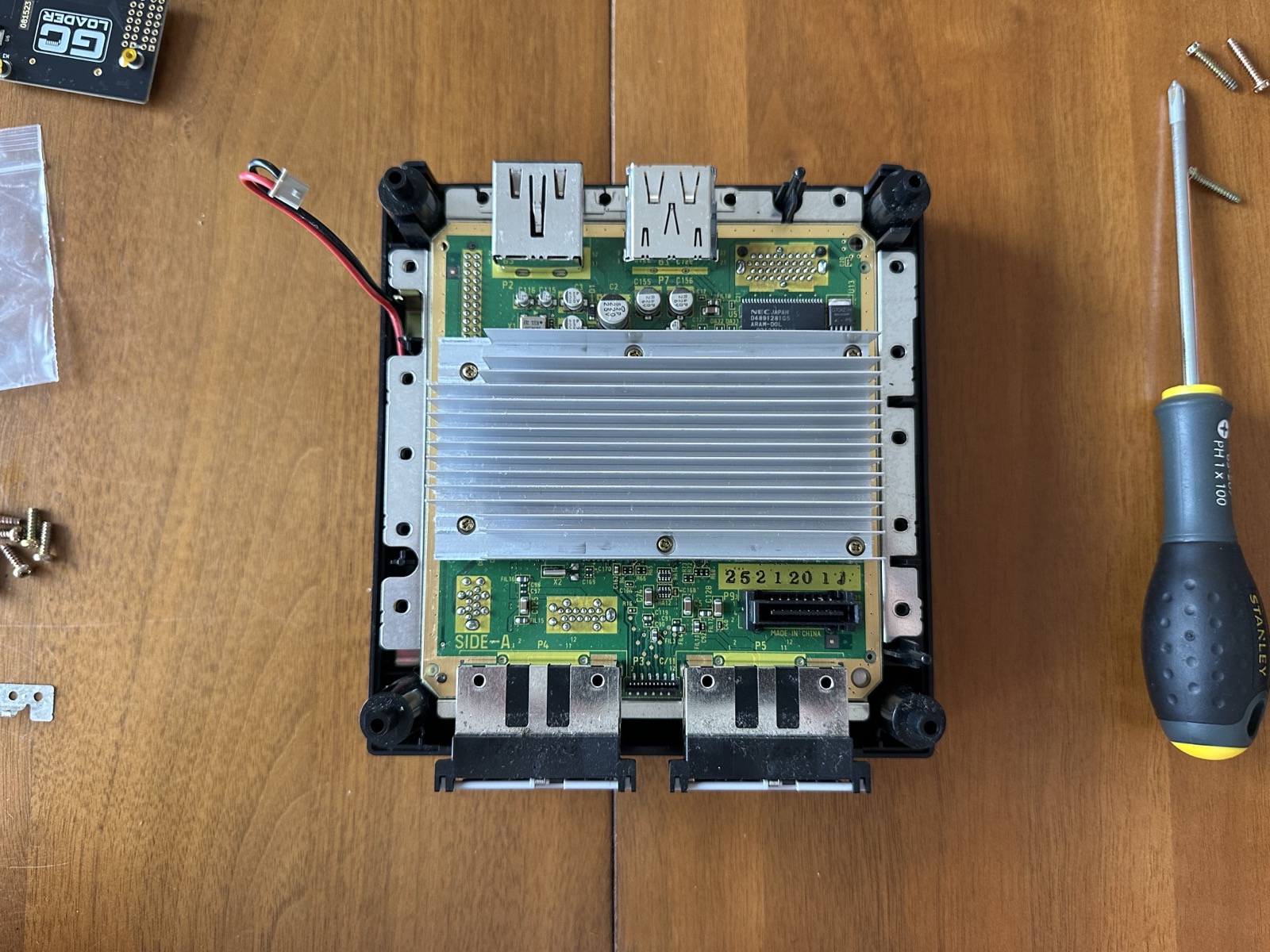 The motherboard exposed after the drive is fully removed