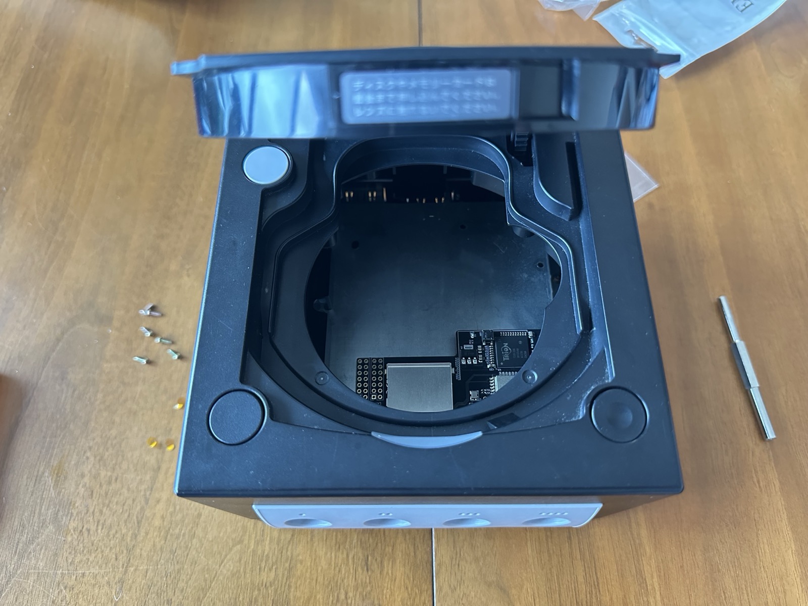 The SD card slot, visible through the open disc lid