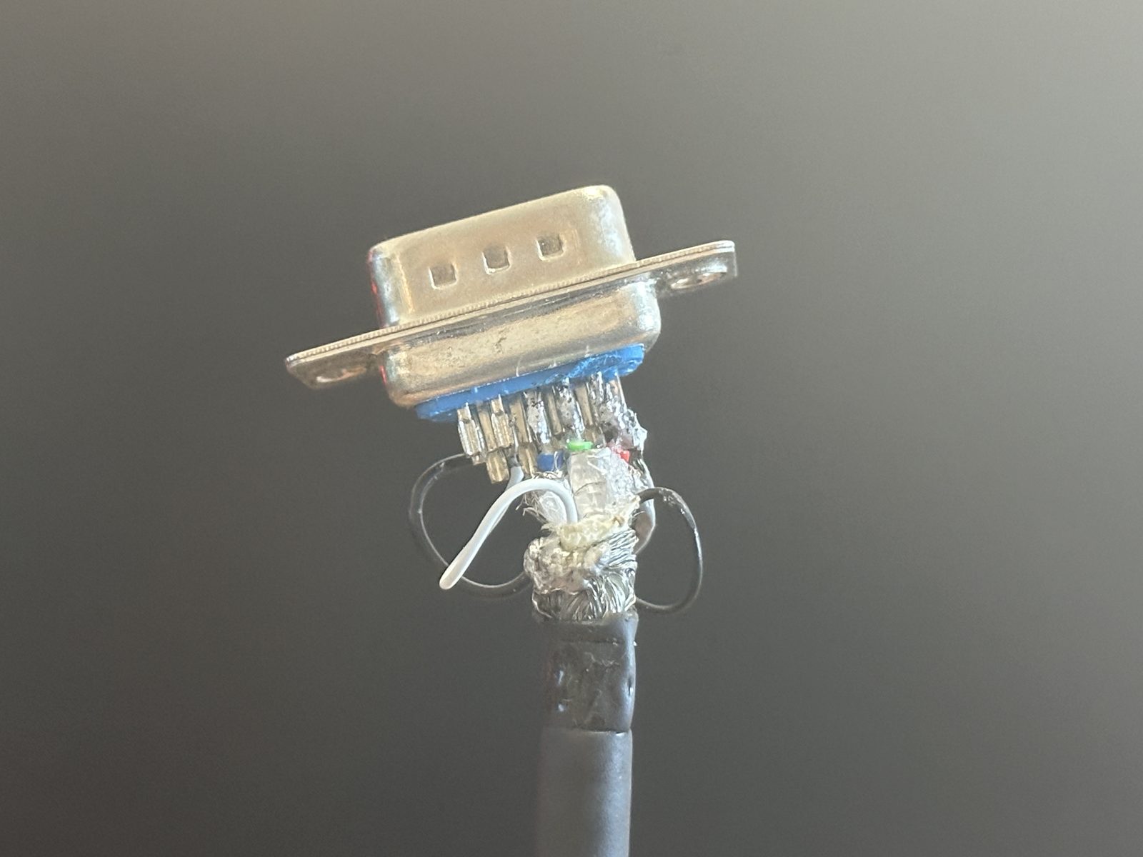 The re-soldered VGA connector, wires trimmed and reattached to their pins