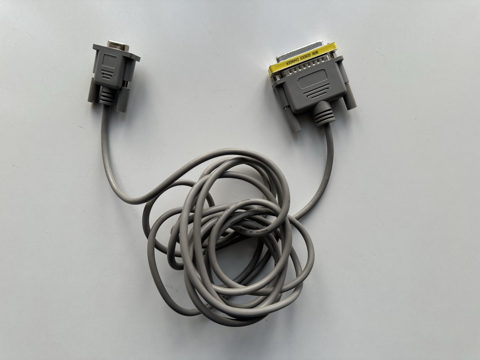 The null modem cable, with the Mini Gender Changer adapter visible on one end