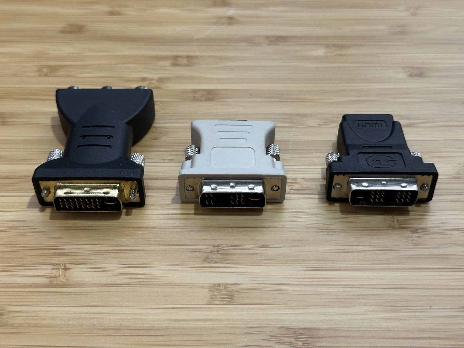 The same three adapters showing their DVI-I connectors