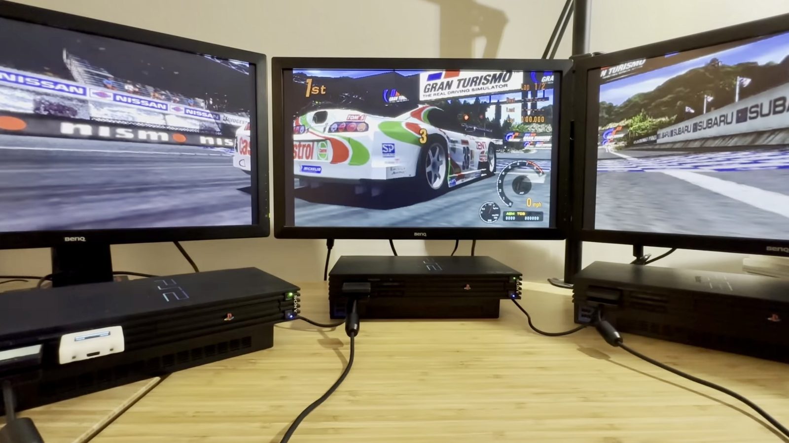 All three PS2s booted into Gran Turismo 3, moments before a race