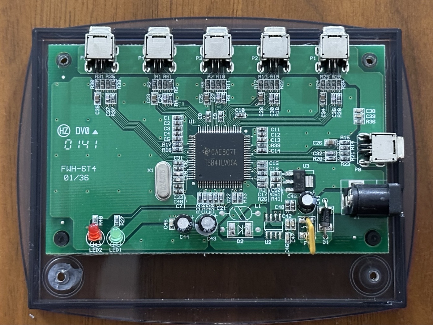 The board, showing the TI TSB41LV06A hub chip