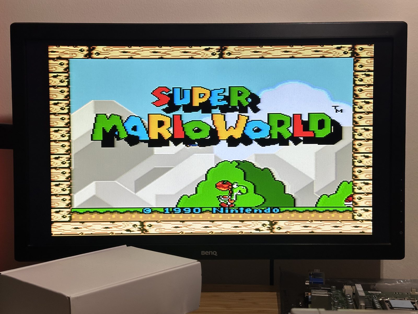 Super Mario World's title screen, running on the fixed console