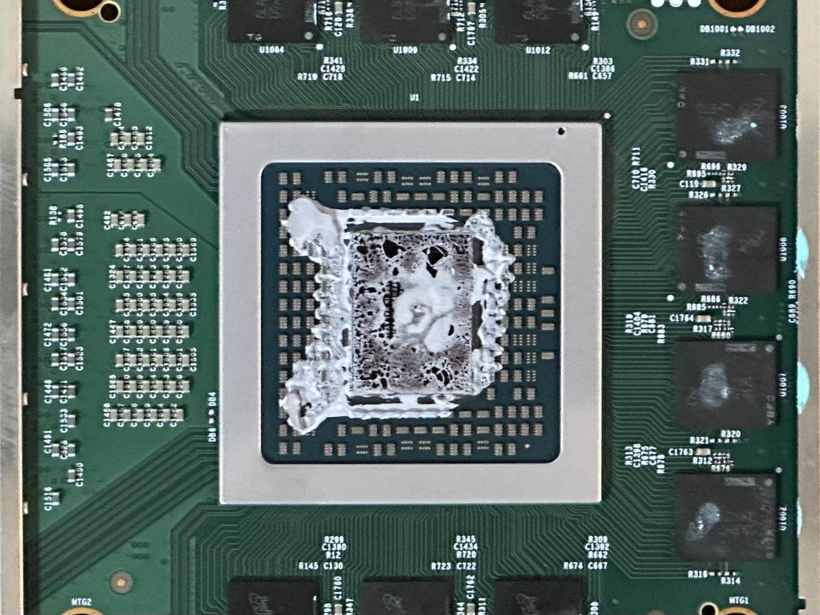 The Xbox Series X APU die, covered in completely dry, cracked thermal paste